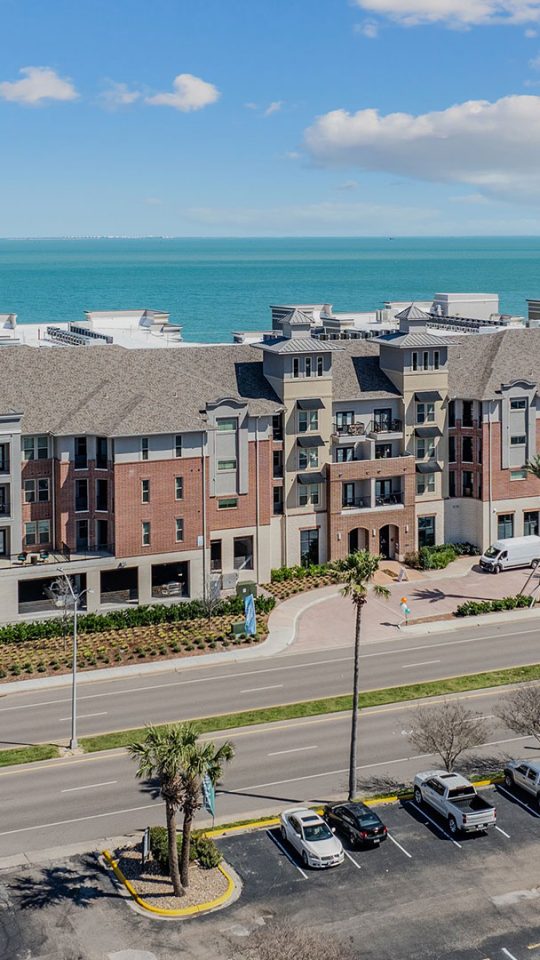 the beach and ocean from above at a condo complex at The  Alexa