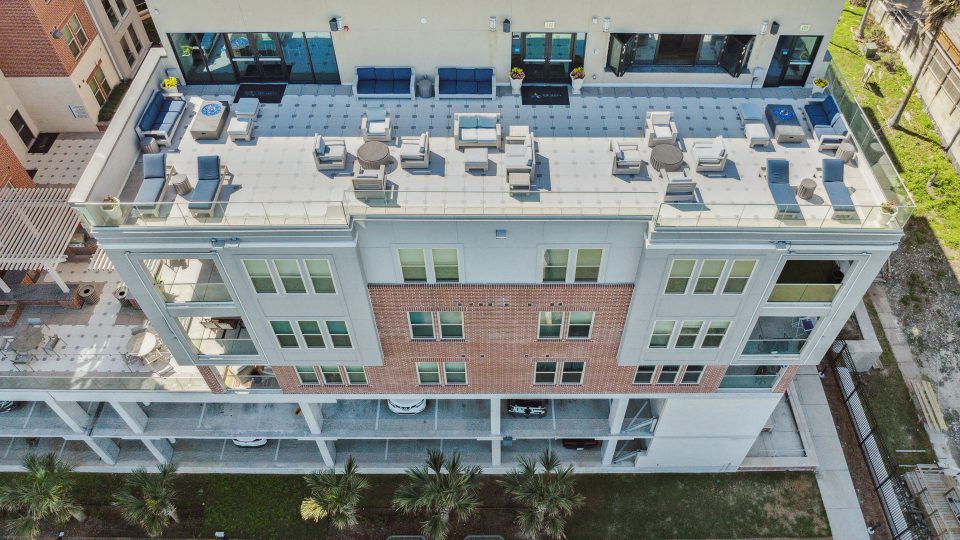 an aerial view of a building with a pool and patio at The  Alexa