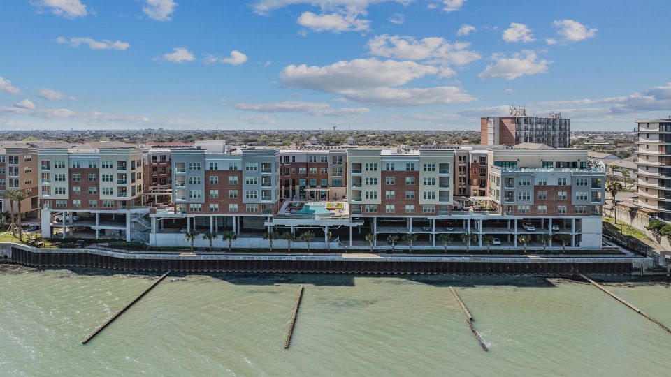 the apartment building is located on the water at The  Alexa