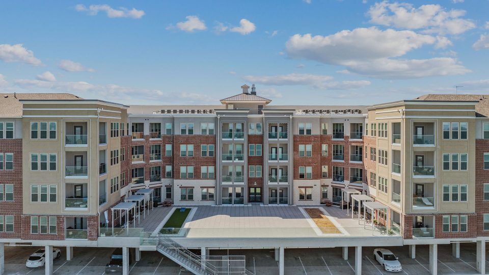 the exterior of a multi - story apartment building at The  Alexa