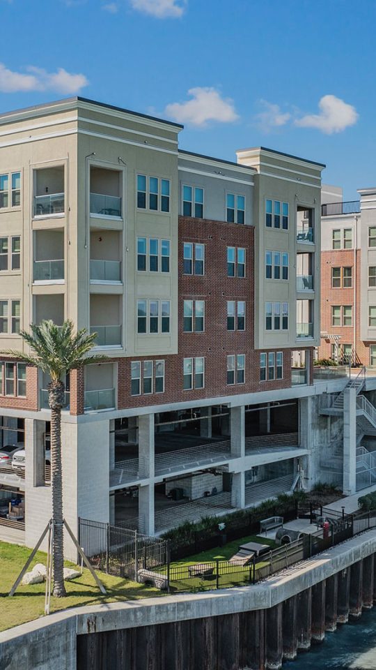 the apartment complex is located on the waterfront at The  Alexa