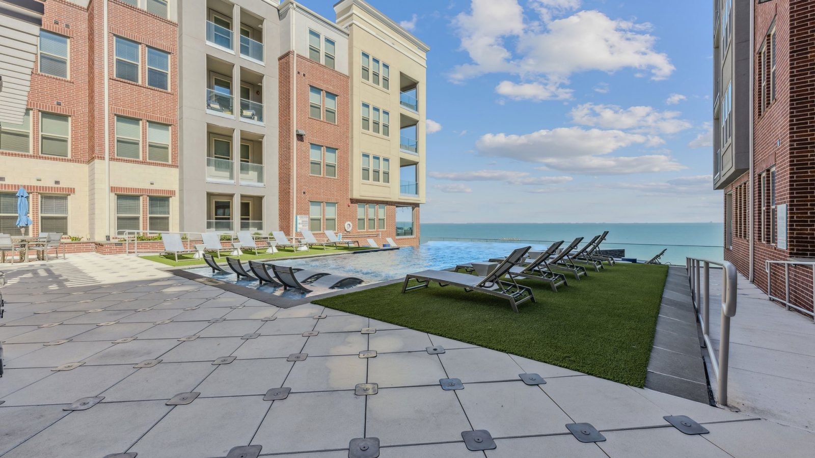 the pool and patio area at The Alexa